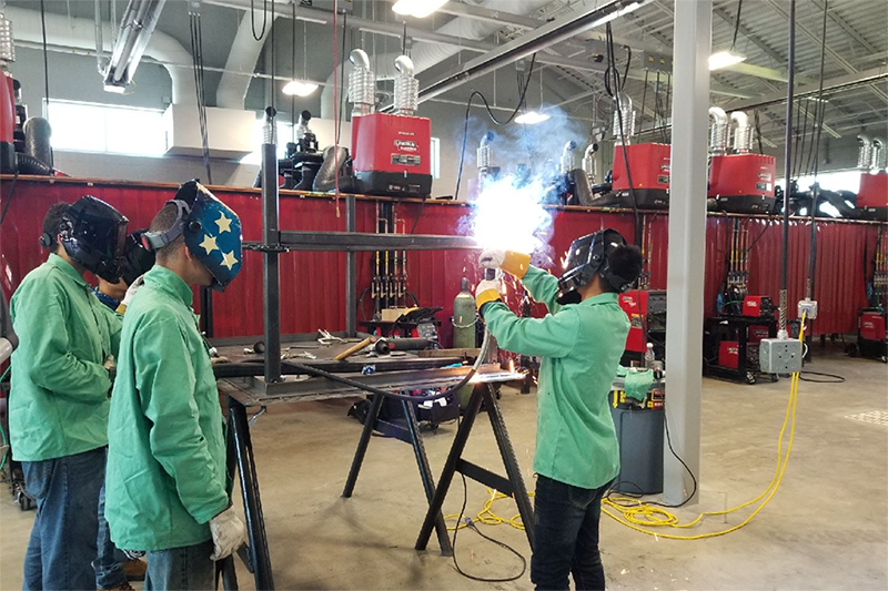 Students practicing welding.